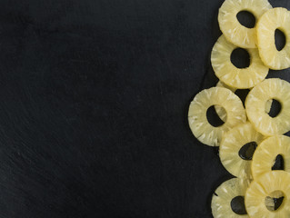 Portion of Preserved Pineapple Rings on a slate slab