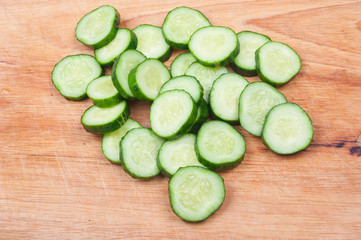 Cucumber sliced on a wooden board