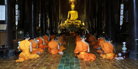 monks praying in temple,chiang mai , Thailand