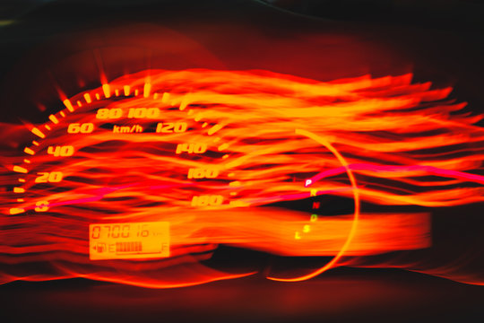 Light Blur image Close up speedometer in car