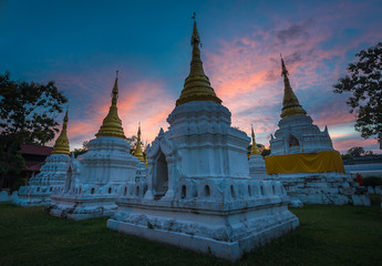 Fototapeta premium Dramatic sunset over Lanna Thai Pagoda, Thailand