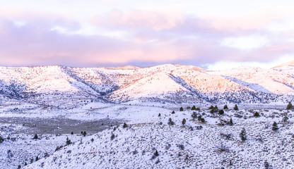 Fototapeta na wymiar Snowy mountain landscape with sky