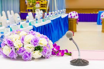 microphone wireless on stand table in conference seminar room with copy space add text  :Select focus with shallow depth of field.