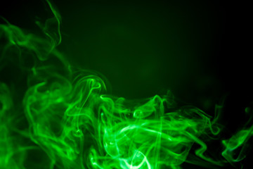 Green smoke motion on black background.