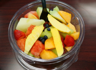 fresh fruit salad inside plastic container