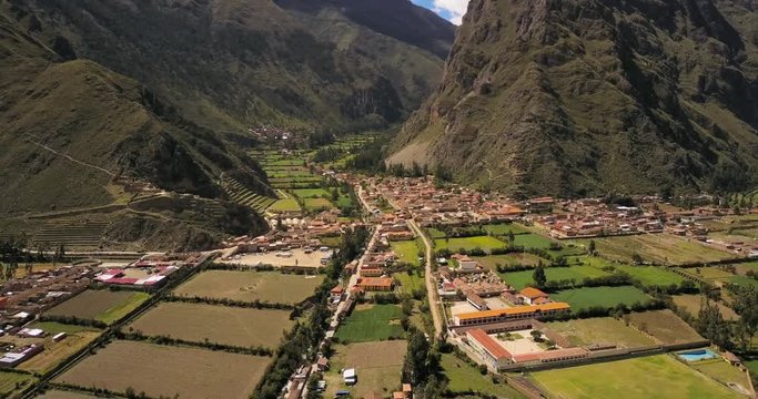 Ollantaytambo Peru Aerial v2 Flying low over small town panning