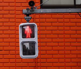 Traffic lights for pedestrian showing the red