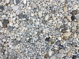 Fototapeta premium Texture pattern of pebbles gravel and small stones in walk way path for garden interior decoration