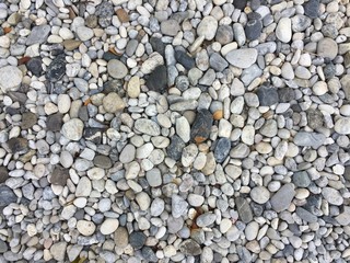 Texture pattern of pebbles gravel and small stones in walk way path for garden interior decoration