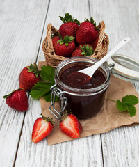 Strawberry jam and fresh strawberries