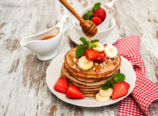 Pancakes with strawberries and bananas