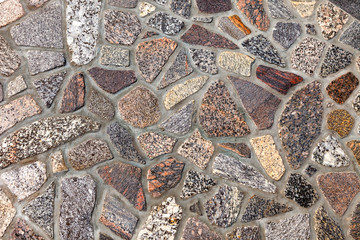 Surface of polished colored granite. Footpath, pavement of granite