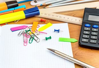 School desk with the school supplies. Back to school concept.