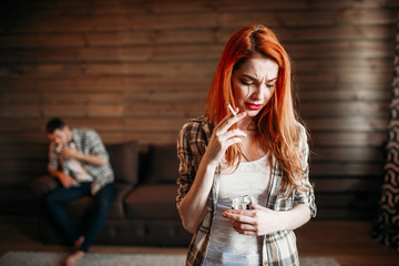 Family quarrel, wife smoking cigarette