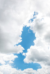 Blue sky between clouds. Natural background.