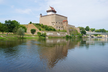 Fototapeta na wymiar Herman's Castle over the Narva river on the August day. Narva, Estonia
