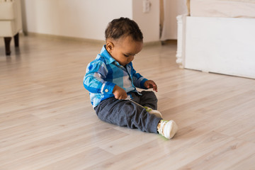 African American baby boy indoors