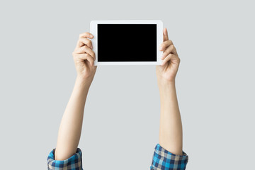 Hands raising digital tablet