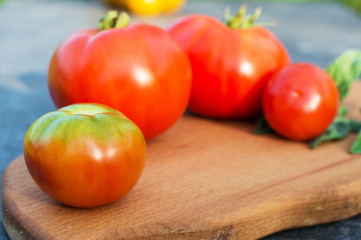 Yellow and red tomatoes on the board