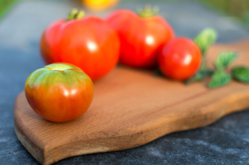 Yellow and red tomatoes on the board