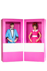boy and girl dolls in box