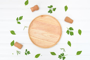 Cooking background with wooden plate from top view