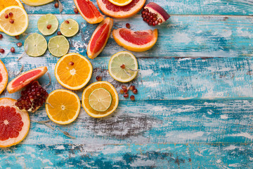 Citrus fruits. Oranges, limes and lemons. Over wood table background with copy space
