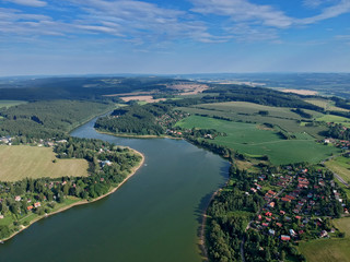 Fototapeta na wymiar Summer scene of the Seč dam in Central Europe - Czechia - from airplane