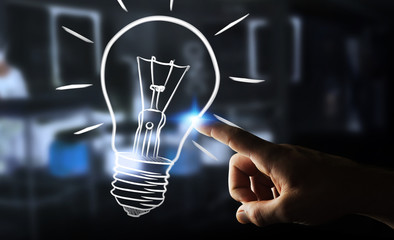 Businesswoman touching a sketch lightbulb