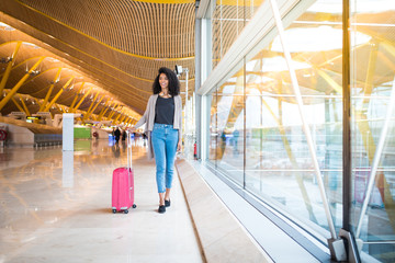woman front walking at the airport