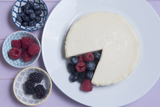 Vanilla cheesecake with blueberries, blackberries and raspberries