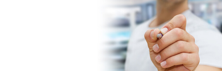 Panorama view of a businessman writing with a pen