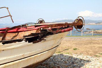 old and rusty fishing ship in a view point