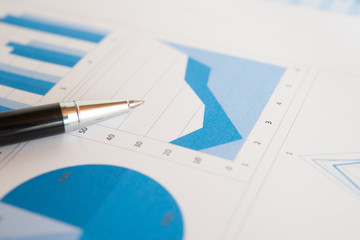 Pen on a business report