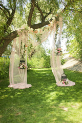 Wedding decor, decor in the trees, flowers in black cages