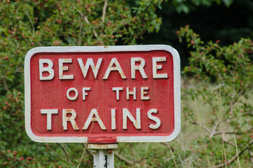 Old fashioned cast iron Beware of Trains sign