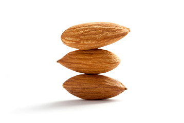 tower of almonds isolated on white