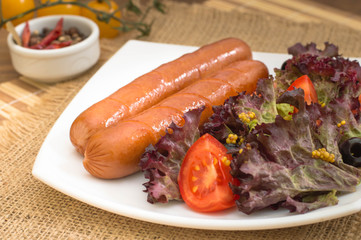 Grilled sausages and vegetables