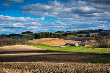 Fototapeta na wymiar Spring view of the meadow and field in Suwalski landscape park, Podlasie, Poland