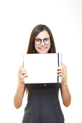 Young beautiful woman in glasses on white isolated background holds notebook teacher emotions