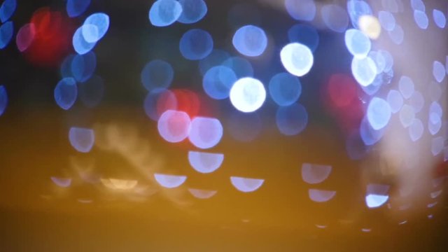 Camera Moves along Blurred Blue and Red Light Spots
