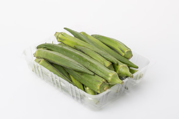 Fresh okra isolated on a white background.