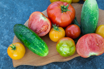 Yellow and red tomatoes on the board