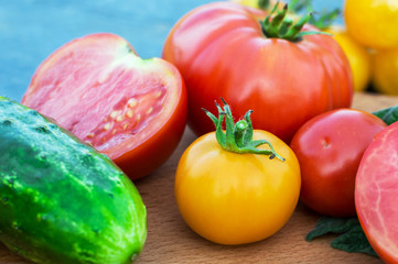 Yellow and red tomatoes on the board