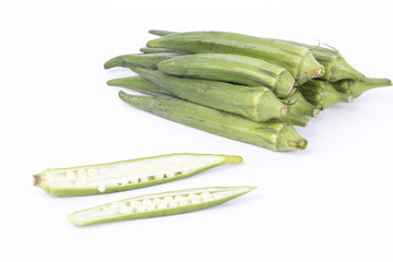Closeup of okra on a white background.