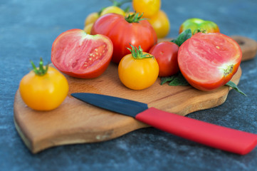 Yellow and red tomatoes on the board