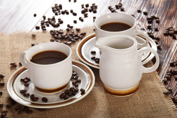 cups of coffee and milk and roasted coffee beans