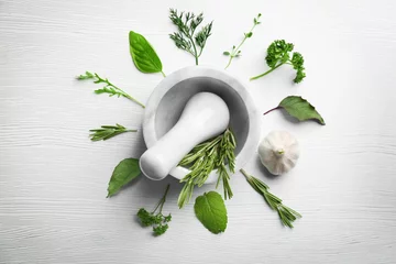 Wall murals Herbs Composition with fresh herbs and mortar on wooden background
