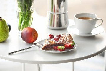 Table with delicious breakfast at home