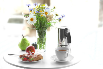Table with delicious breakfast at home